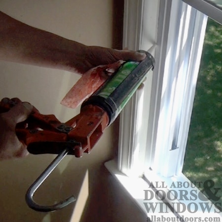 caulk inside stop window frame